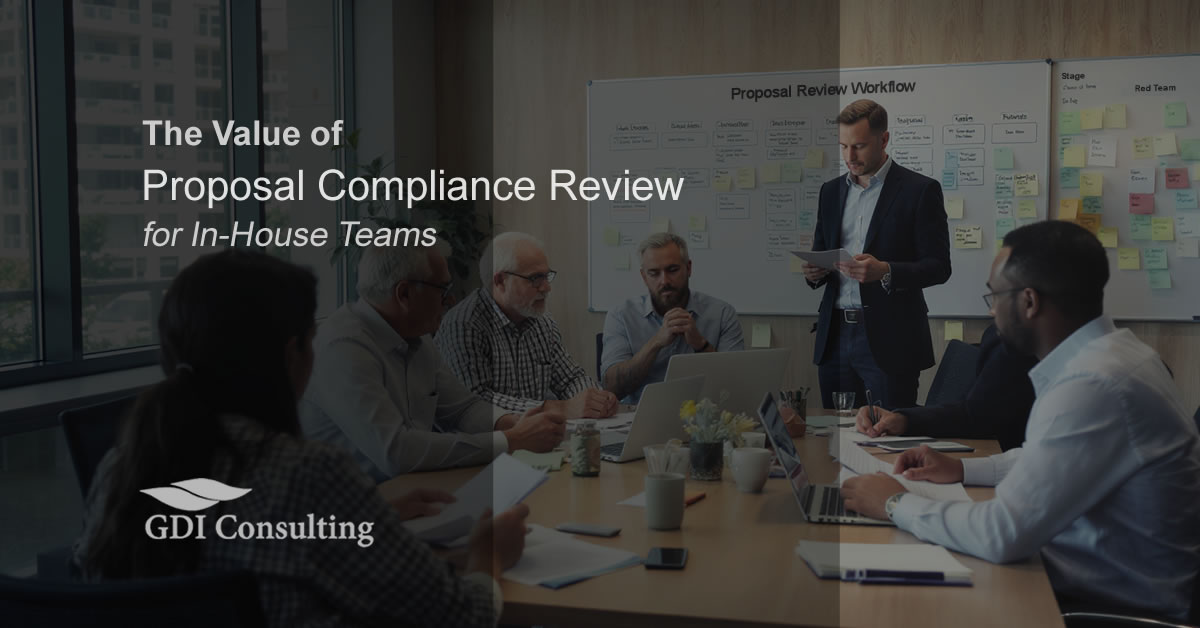 Corporate team reviewing a proposal compliance workflow in a conference room, highlighting the value of compliance reviews for in-house proposal teams. - GDI Consulting