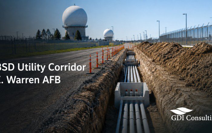 Utility corridor construction with underground conduits near a secure federal installation, representing GBSD Utility Corridor work at F.E. Warren AFB.